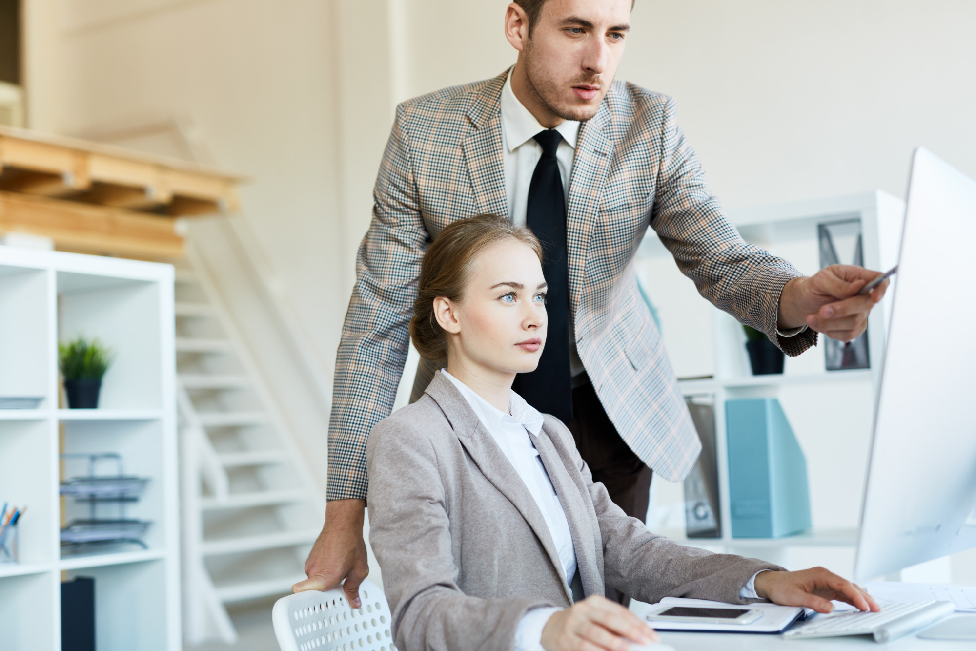 A team of accountants collaborating in a contemporary meeting room, (friendly atmosphere:1.2), [professional attire], [charts and graphs on the wall], -[distracting elements],  [clear communication]